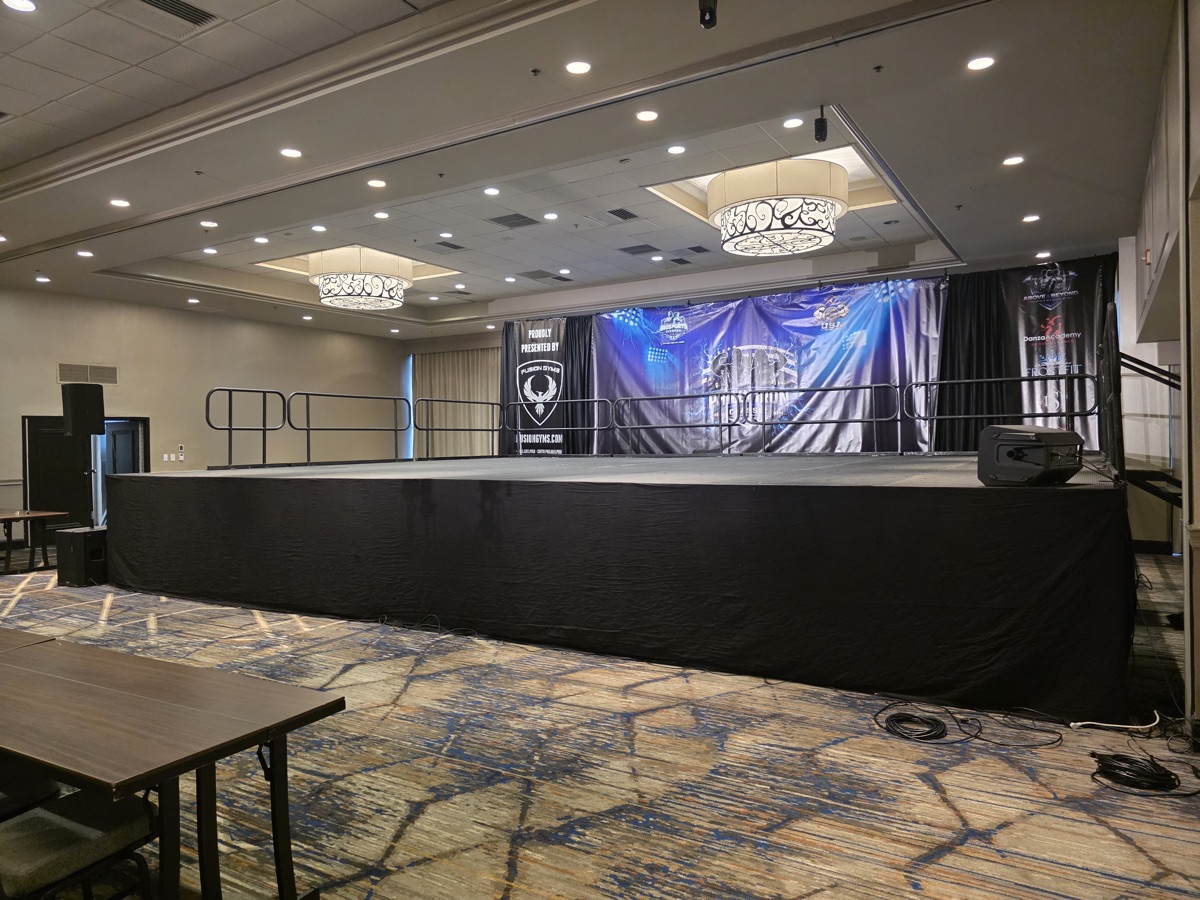 Philly Iron Classic — 32 by 24 foot elevated stage with black drape backdrop at The Alloy, King of Prussia